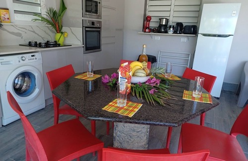 Sainte-Rose Cottage | Beachside Apartment with Pool in Historic Colonial House