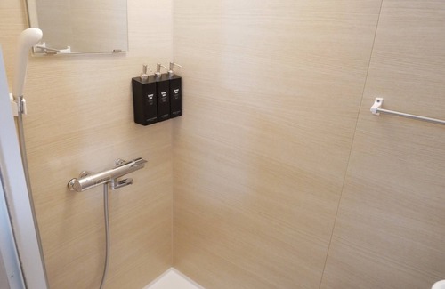 Amami Hotel | Discover HOOD Inn: Private Sauna & Family-Friendly Comfort