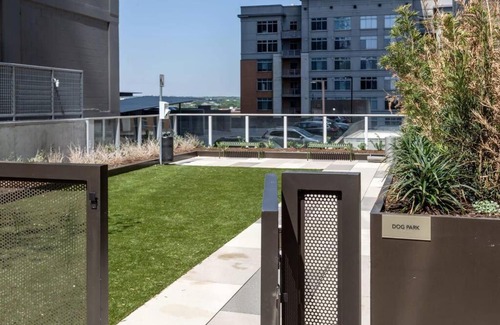 Rainey Street Historic District Apartment | Elevated Condo with Pool on Rainey Street by Locale