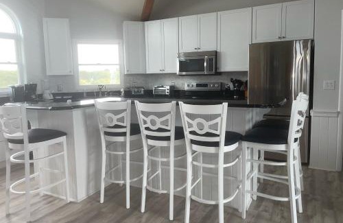 Pine Island House | Escape to Aegean Breeze: Family-Friendly Retreat Awaits