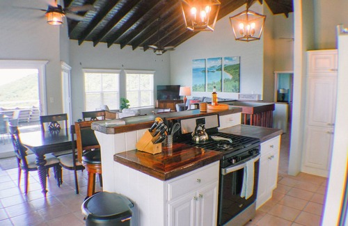 Estate Enighed Villa | Ultimate Sunrise Retreat: Oceanfront Spa & Hot Tub Escape