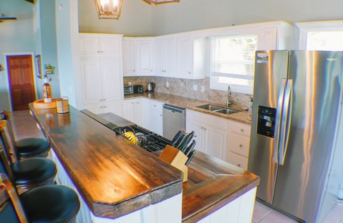 Estate Enighed Villa | Ultimate Sunrise Retreat: Oceanfront Spa & Hot Tub Escape