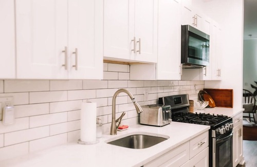 Norris Square House | Cozy 2BD Retreat with Dedicated Office & Family Amenities