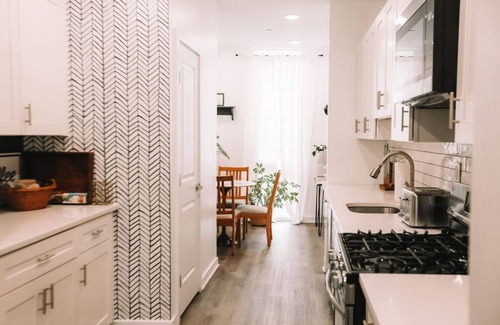 Norris Square House | Cozy 2BD Retreat with Dedicated Office & Family Amenities