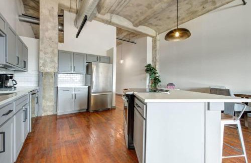 Crossroads Arts District Apartment | Inviting Historic Loft with Gym for Family Stays by ENVITAE