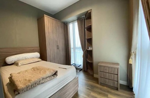 Jakarta Apartment | Inviting 2BR Taman Anggrek Residences with Pool & Spa