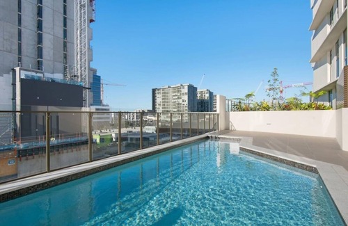 Newstead Apartment | Inviting 2BR Retreat with Gym, Pool & Rooftop Terrace