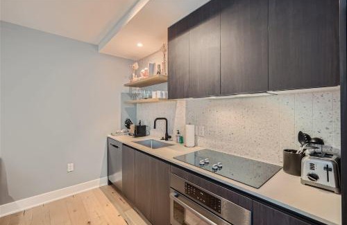 Rainey Street Historic District Apartment | Elegant 2BR Retreat with Rooftop Pool and Scenic Views