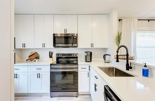 Bay Acres House | Cozy King Bed & Patio, Steps from the Beach Experience
