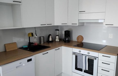 Ylamylly Apartment | Riverside Retreat with Balcony and Hot Tub Amenities