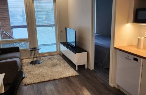 Ylamylly Apartment | Riverside Retreat with Balcony and Hot Tub Amenities