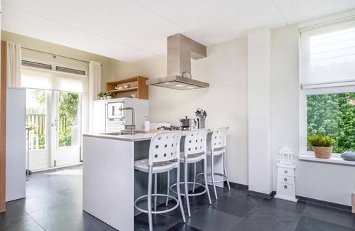 Municipality of Hollands Kroon House | Cozy 2 Bedroom Retreat in Wieringerwerf with Lake View