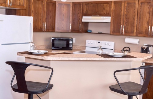 Grande Prairie House | Cozy 3-Bedroom Retreat with Private Patio Near Dining