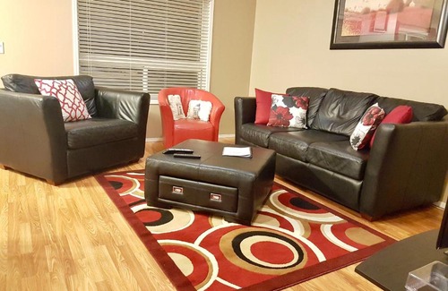 Grande Prairie Apartment | Cozy Retreat with Private Patio, 4-Star Rating & Perfect Location