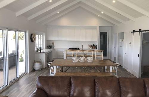 Waterhouse House | Prime Location: Steps to Dining, Shops & Beautiful Beach
