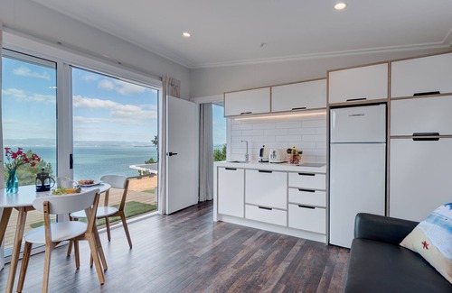 Waiheke Island Ski Chalet | Charming Chalet with Private Deck & Breathtaking Sea Views