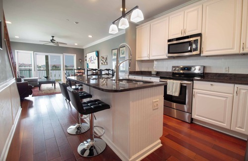Waters Edge Condo | Riverfront Haven: 3BR Pool & Dock Access, Perfect for Families