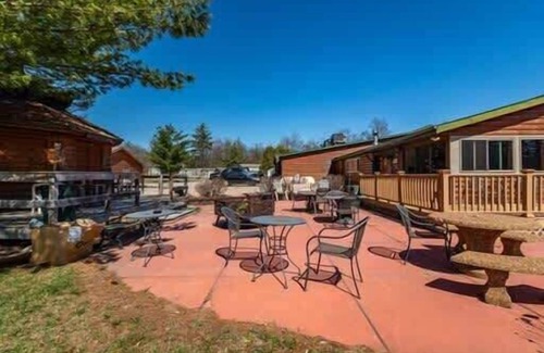 Neillsville Cabin | Experience Riviera Pub and Grill Just Steps from Your Cabin