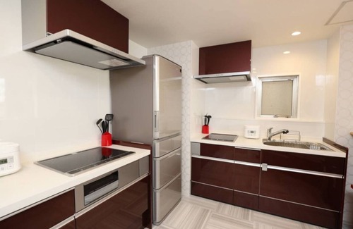 Kita Ward Apartment | Convenient Hostel Steps from Okayama Station with Spa