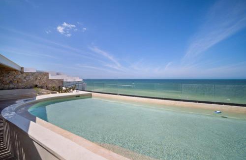 Dzemul Apartment | Family-Friendly 4-Bedroom Beachfront Apartment with Pool