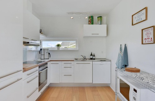 Pøt Strandby House | Inviting Oceanfront Cottage with Spa and Hot Tub Amenities