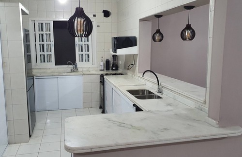 Balneario Praia do Pernambuco House | Ideal 4 Bedroom Beachfront Home in Guarujá for Families