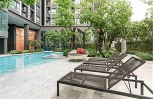 Kabin Buri Apartment | Relax at 4-Ideo New Rama 9: Poolside Comfort & WiFi