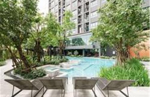Kabin Buri Apartment | Relax at 4-Ideo New Rama 9: Poolside Comfort & WiFi
