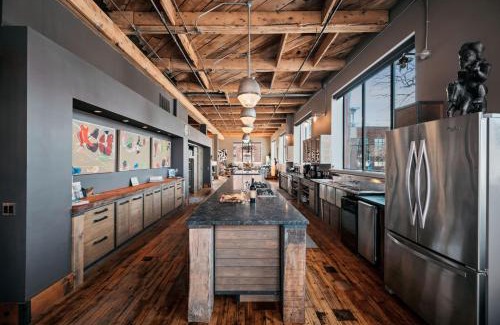 Traverse City Apartment | Unique 4BR Loft in NOBO District with Hot Tub & Pet Friendly