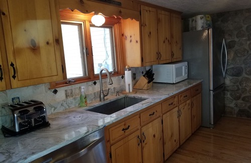 North Sebago House | Lakefront Retreat with 5 Bedrooms and Sandy Beach Access