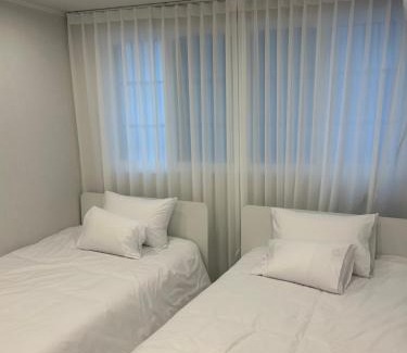 Seogyo-dong Apartment | 5-Minute Walk from Hongdae Station, Hotel-Style Bedding, 2 Rooms, Washer Dryer