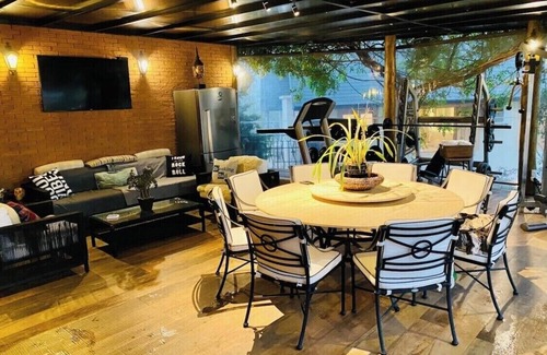 Campos do Jordao House | Exquisite Mountain Retreat with Pool, Sauna & Gym Amenities