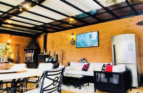 Campos do Jordao House | Exquisite Mountain Retreat with Pool, Sauna & Gym Amenities