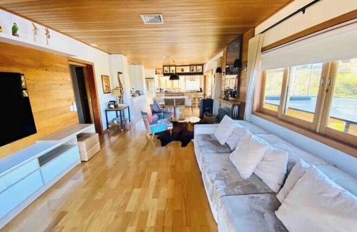 Campos do Jordao House | Exquisite Mountain Retreat with Pool, Sauna & Gym Amenities