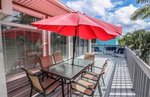 Mid Island House | Relax at 5570 Palmetto Street: Pet-Friendly & Poolside Retreat