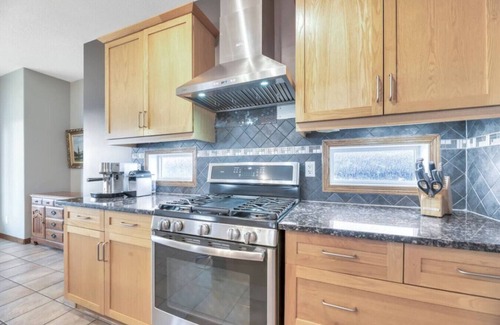 Chestermere House | 5BR Gem w/Pizza Oven, Theater & Views