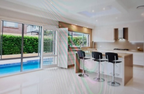 Kellyville House | Discover a 5-Star Oasis: Pool, Spa & Ocean Views Await
