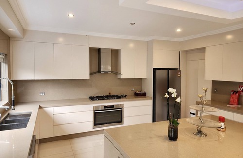 Kellyville House | Discover a 5-Star Oasis: Pool, Spa & Ocean Views Await