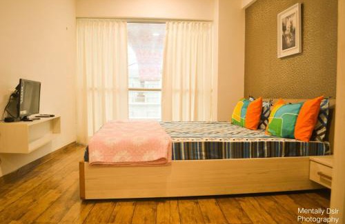 Dumas Apartment | Weekend Retreat at Rajhans Belliza with Oceanfront Pool