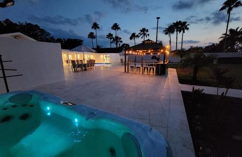 Palma Sola House | 75 Palms: Spacious Retreat with Pool, Spa & Game Room