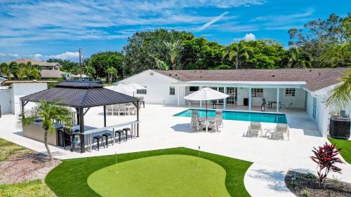 Palma Sola House | 75 Palms: Spacious Retreat with Pool, Spa & Game Room