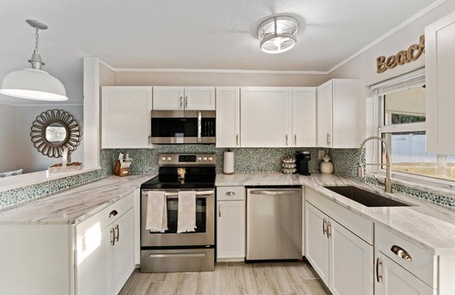 Jensen Beach House | Discover Relaxation: Hot Tub, Beach Access & Fire Pit
