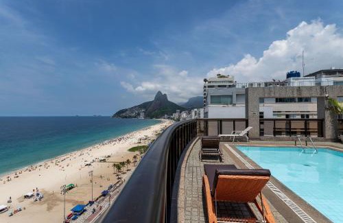 Ipanema Apartment | Oceanfront Escape: Ipanema Beach with Pool & Restaurant