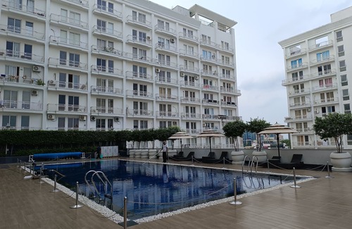 Gomti Nagar Apartment | Inviting 9-Bedroom Retreat with Pool and Scenic Terrace