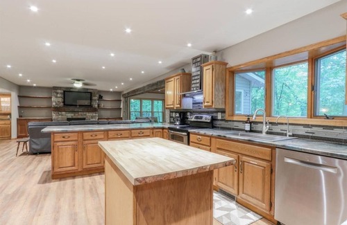 Waupaca House | Modern Retreat with Hot Tub by Wooded River - Rated 9.4/10