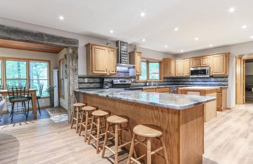 Waupaca House | Modern Retreat with Hot Tub by Wooded River - Rated 9.4/10