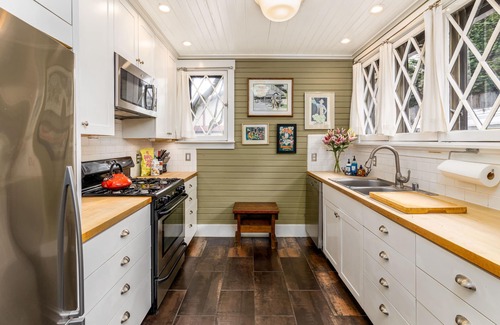 Portage Bay Cottage | Quaint City Cottage with Spa and Backyard Chickens Awaits