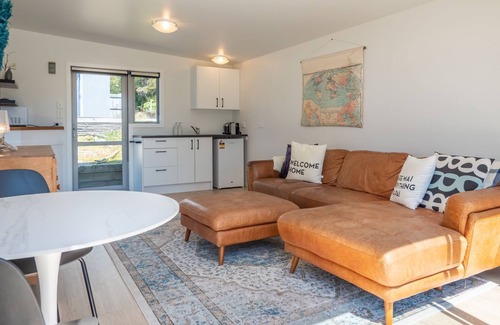 Pohara Cabin | Bright Beachside Cabin with Ocean View Steps from the Shore