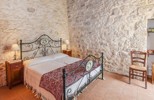 Modica House | A cottage decorated in country style with rustic details.