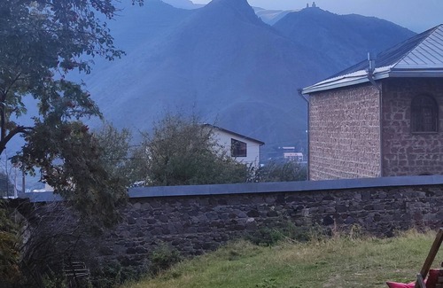 Stepantsminda House | Idyllic House with Veranda and Scenic Kazbegi Views